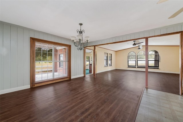 unfurnished room with hardwood / wood-style flooring, lofted ceiling with beams, and ceiling fan with notable chandelier