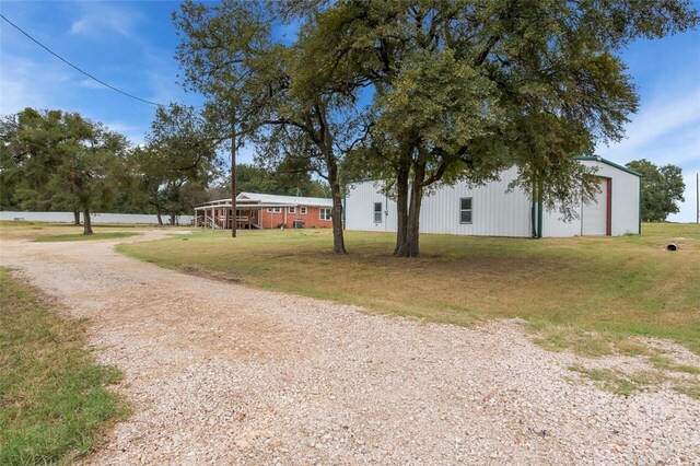 exterior space with a garage and an outdoor structure