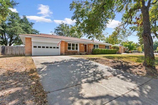 ranch-style home featuring a garage