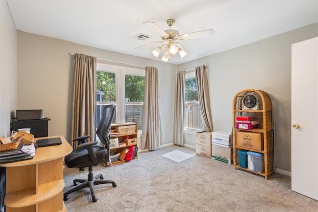 home office featuring ceiling fan and carpet floors