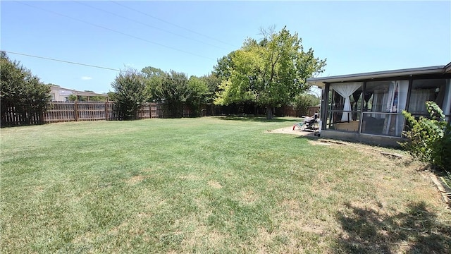 view of yard with a sunroom