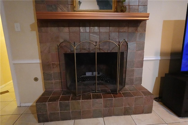 interior details with a tiled fireplace