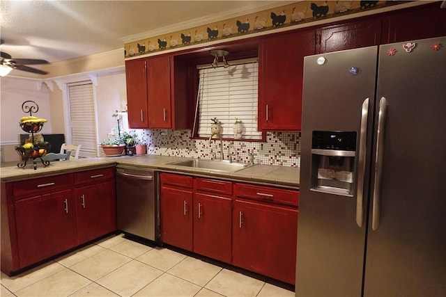 kitchen with backsplash, stainless steel appliances, crown molding, and sink