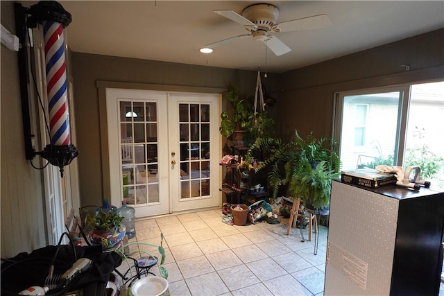 doorway to outside with ceiling fan, french doors, and light tile patterned floors