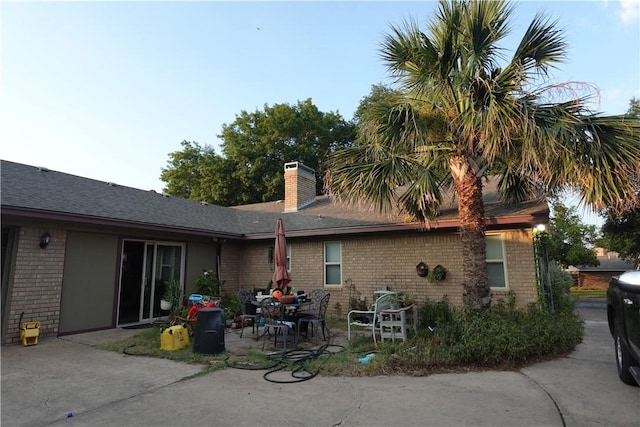 back of house with a patio