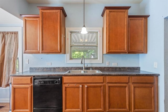 kitchen featuring dishwasher, sink, and decorative light fixtures