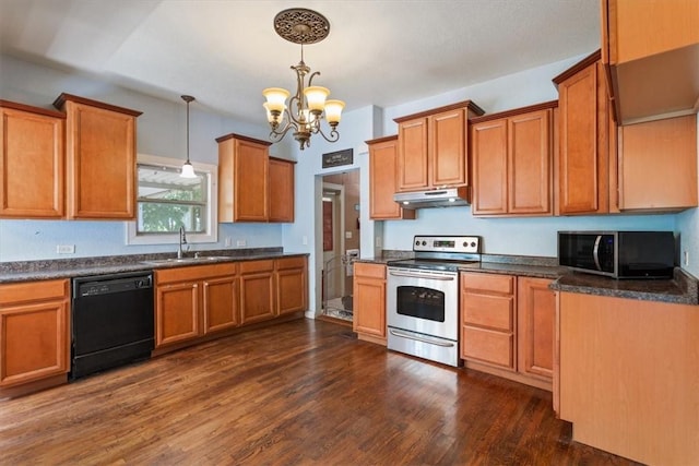 kitchen with appliances with stainless steel finishes, dark hardwood / wood-style flooring, sink, decorative light fixtures, and a chandelier