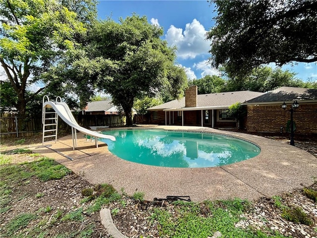 view of swimming pool featuring a water slide