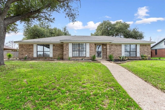 ranch-style house with a front lawn