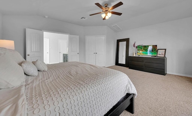 carpeted bedroom with lofted ceiling, ceiling fan, visible vents, and baseboards