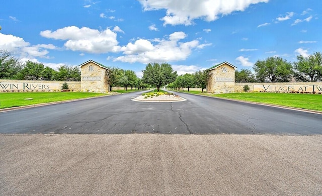 view of road featuring curbs