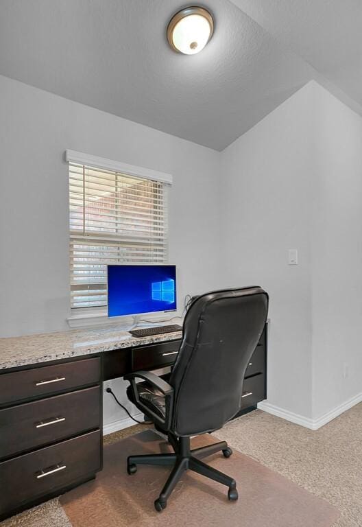 home office with light carpet and baseboards