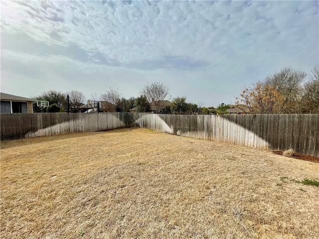 view of yard with a fenced backyard