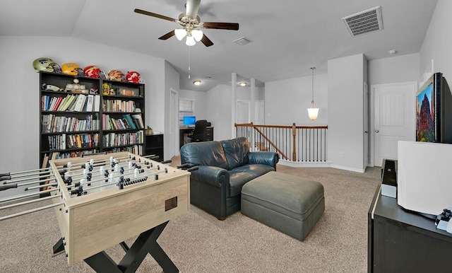 rec room featuring lofted ceiling, carpet, visible vents, and ceiling fan