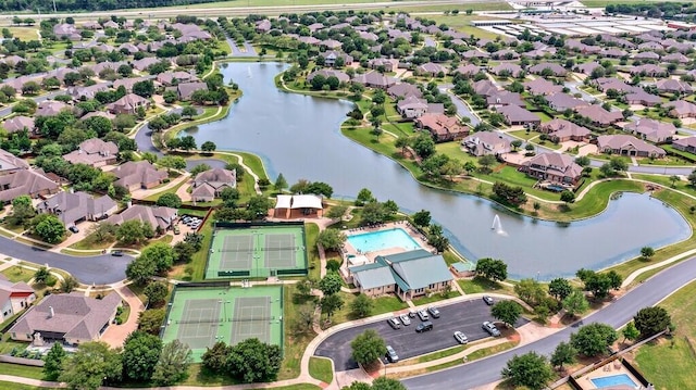 bird's eye view featuring a water view and a residential view