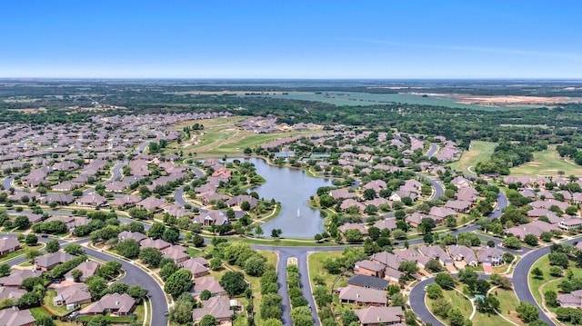 birds eye view of property featuring a water view and a residential view