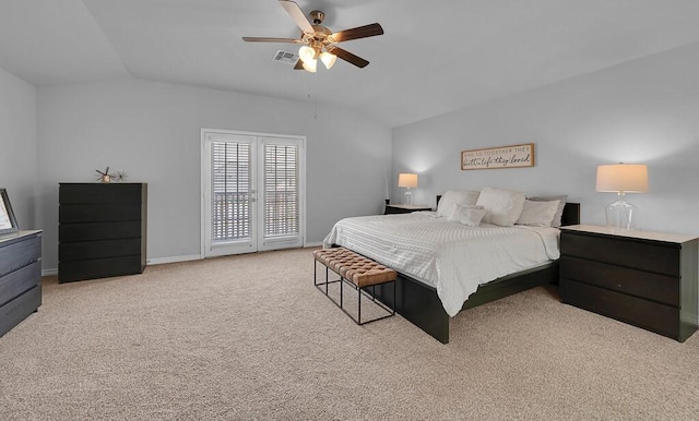 bedroom with lofted ceiling, carpet, baseboards, and visible vents