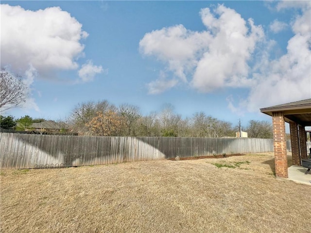 view of yard with a fenced backyard