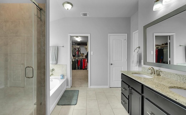 full bathroom featuring visible vents, a sink, tile patterned flooring, a shower stall, and a bath