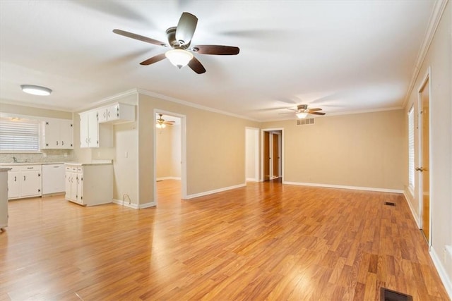 unfurnished living room featuring crown molding and light wood-type flooring