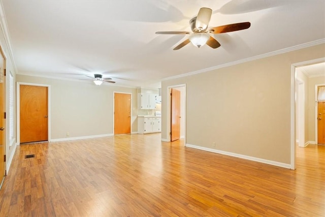 unfurnished room with ornamental molding, ceiling fan, and light wood-type flooring