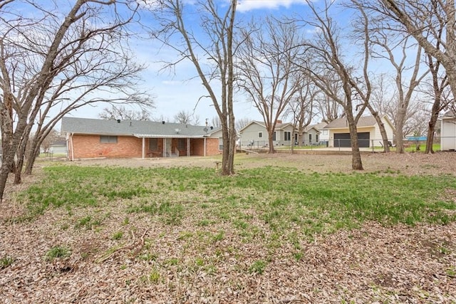 view of yard featuring a garage