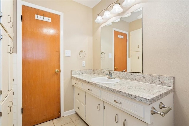 bathroom featuring vanity and tile patterned flooring