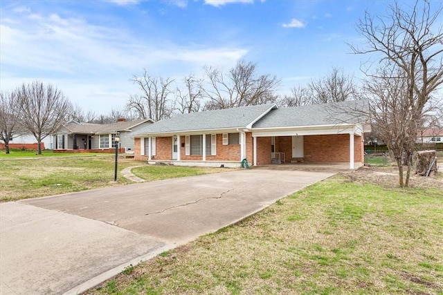 ranch-style house with a front lawn and a carport