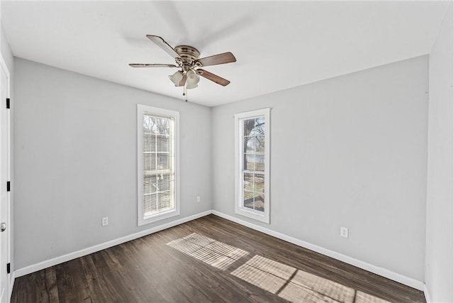 unfurnished room with dark hardwood / wood-style floors and ceiling fan