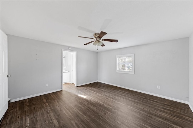 unfurnished room with dark wood-type flooring and ceiling fan