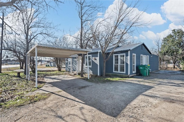 view of side of home featuring a carport