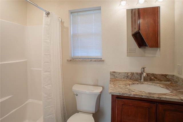 full bathroom with vanity, shower / bath combo with shower curtain, and toilet