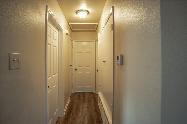 hall with dark hardwood / wood-style flooring