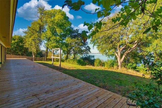 wooden terrace with a lawn