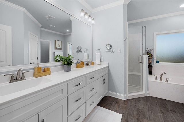 bathroom featuring hardwood / wood-style floors, vanity, crown molding, and independent shower and bath