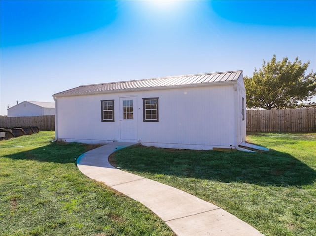 exterior space with a front yard