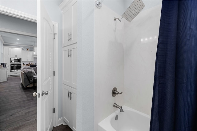 bathroom featuring shower / tub combo with curtain and wood-type flooring