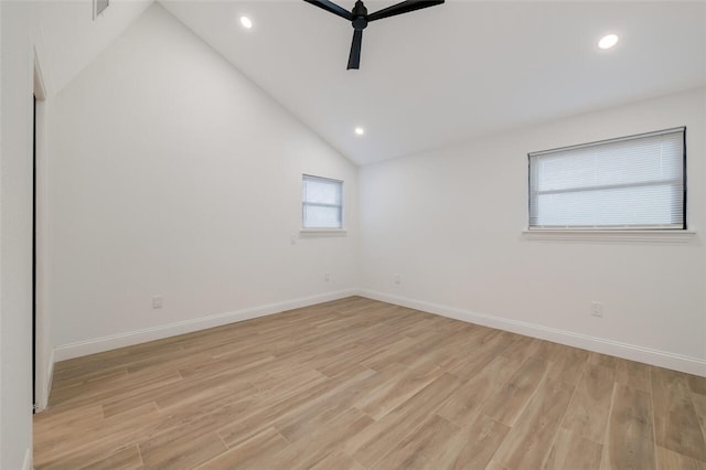 unfurnished room with light hardwood / wood-style floors, high vaulted ceiling, and ceiling fan