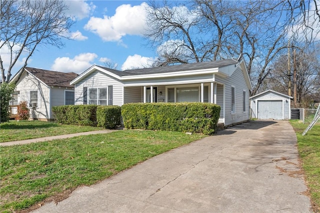 view of front of property featuring an outbuilding, a garage, and a front lawn