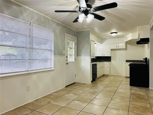 kitchen with ornamental molding, ceiling fan, black appliances, light tile patterned floors, and white cabinets