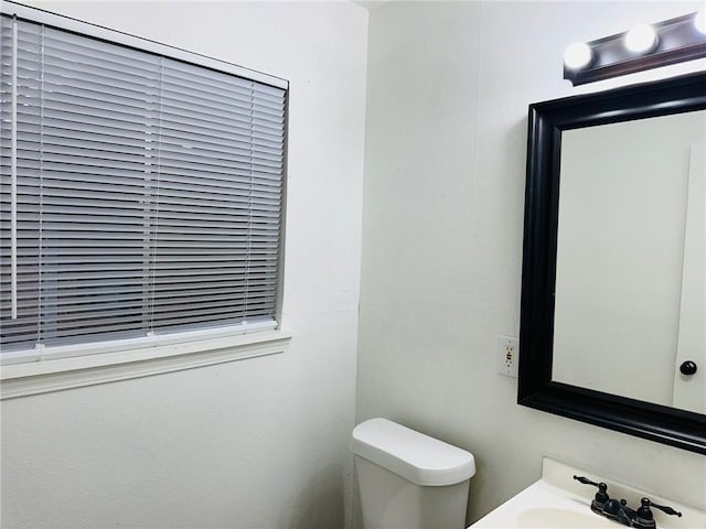 bathroom with sink and toilet