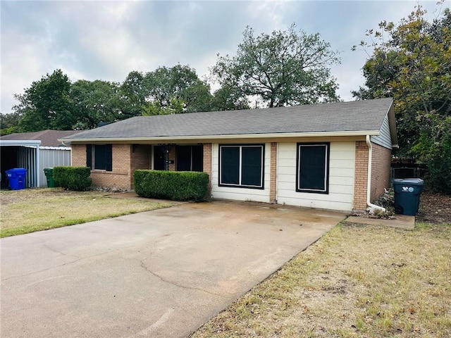 ranch-style house with a front lawn