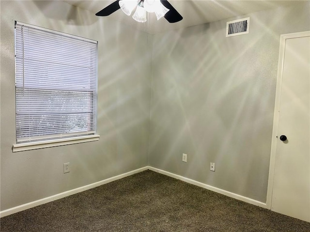 carpeted spare room with ceiling fan