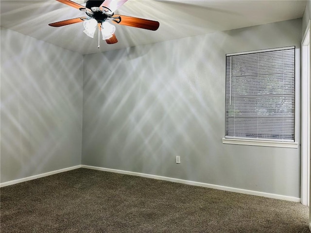 empty room featuring carpet flooring and ceiling fan