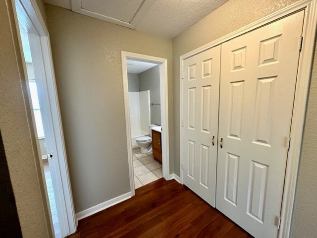 corridor with dark wood-type flooring