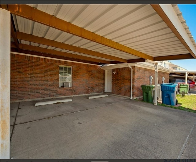 view of parking / parking lot featuring a carport