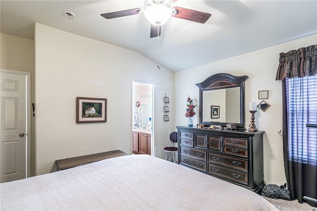 bedroom featuring lofted ceiling, connected bathroom, and ceiling fan