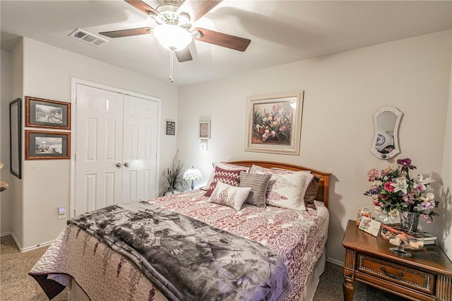 carpeted bedroom featuring a closet and ceiling fan