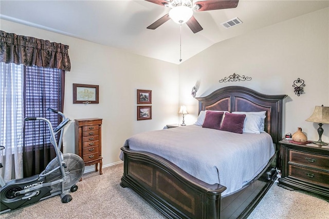 bedroom featuring ceiling fan, vaulted ceiling, and light carpet