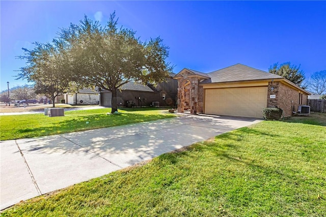 ranch-style house with a garage, central AC unit, and a front yard